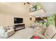 Cozy living room with high ceilings and an electric fireplace at 3159 Via Como, Henderson, NV 89044