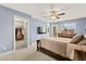Serene bedroom with a walk-in closet, private balcony, and soft, natural light at 3159 Via Como, Henderson, NV 89044