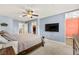 Spacious main bedroom featuring a ceiling fan and adjoining bathroom at 3159 Via Como, Henderson, NV 89044