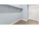 Functional mudroom with built in shelving, tile floor, and white door at 3159 Via Como, Henderson, NV 89044