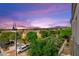 Picturesque neighborhood view with colorful twilight sky, lush trees, and well-maintained streets at 3159 Via Como, Henderson, NV 89044