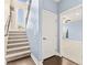 Bright stairway with carpet and wood floors connects to another room with natural light at 3159 Via Como, Henderson, NV 89044