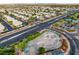 Aerial view of a modern skate park featuring a variety of ramps, rails, and a smooth concrete surface at 3481 Creek River Dr, Las Vegas, NV 89129
