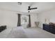 Bright bedroom with a ceiling fan, window, and carpeted floor at 3481 Creek River Dr, Las Vegas, NV 89129