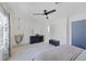 Bright bedroom with a ceiling fan, window, and carpeted floor at 3481 Creek River Dr, Las Vegas, NV 89129