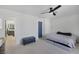 Spacious bedroom featuring a ceiling fan, carpet and a blue door at 3481 Creek River Dr, Las Vegas, NV 89129