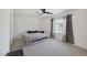 Spacious bedroom featuring a ceiling fan, carpet and a large window at 3481 Creek River Dr, Las Vegas, NV 89129