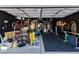 Garage gym with work out equipment and a dedicated rubber floor at 3481 Creek River Dr, Las Vegas, NV 89129