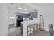 Stylish kitchen features stainless appliances, breakfast bar and adjacent laundry area at 3481 Creek River Dr, Las Vegas, NV 89129