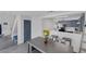 Open kitchen flows into the adjacent living room, features stainless appliances and breakfast bar at 3481 Creek River Dr, Las Vegas, NV 89129