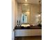 Modern powder room showcases a unique vessel sink, mosaic wall, and stylish lighting at 358 Solitude Peak Ln, Henderson, NV 89012