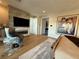 Modern bedroom featuring a fireplace, TV, stylish decor, and hardwood floors, offering a cozy and luxurious ambiance at 358 Solitude Peak Ln, Henderson, NV 89012