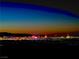 Dramatic night view of the vibrant Las Vegas skyline illuminated against the dark desert sky at 358 Solitude Peak Ln, Henderson, NV 89012