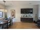 Elegant dining room with hardwood floors, modern lighting, and stylish buffet at 358 Solitude Peak Ln, Henderson, NV 89012