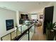 Upper hallway with glass railings overlooking the living room and staircase at 358 Solitude Peak Ln, Henderson, NV 89012