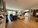 Spacious living room boasts hardwood floors, a modern staircase, and ample natural light at 358 Solitude Peak Ln, Henderson, NV 89012