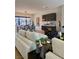 Spacious living room with elegant furnishings, a dining area, built-in bar, and a modern design, perfect for entertaining at 358 Solitude Peak Ln, Henderson, NV 89012