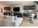 Inviting living room with a cozy fireplace, custom cabinets, and comfortable seating at 358 Solitude Peak Ln, Henderson, NV 89012