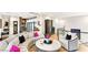 Bright living area showcases a spacious layout with a curved sofa, chair, and stylish round table at 358 Solitude Peak Ln, Henderson, NV 89012