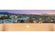 Balcony with panoramic city and mountain views at sunset at 358 Solitude Peak Ln, Henderson, NV 89012