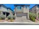 Contemporary home boasting a two-car garage, low-maintenance landscaping, and a welcoming facade at 4160 Elegant Chateau St, Las Vegas, NV 89135