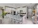 Well-appointed kitchen featuring an island with seating, white cabinetry, and stainless steel appliances at 4160 Elegant Chateau St, Las Vegas, NV 89135