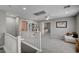 Open loft area with plush carpeting, ceiling fan, and built-in shelving and bonus space at 4160 Elegant Chateau St, Las Vegas, NV 89135