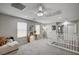 Upstairs loft area featuring neutral decor, a ceiling fan, and access to additional rooms at 4160 Elegant Chateau St, Las Vegas, NV 89135