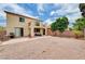 Spacious gravel backyard with a covered patio, comfortable seating, and mature landscaping in a beautiful setting at 4308 Desert Haven Ave, North Las Vegas, NV 89085