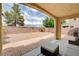 Relaxing backyard with a covered patio, stylish furniture, and easy-care landscaping, perfect for outdoor living at 4308 Desert Haven Ave, North Las Vegas, NV 89085