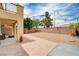 Spacious backyard with a covered patio, low-maintenance landscaping, and privacy wall for outdoor enjoyment at 4308 Desert Haven Ave, North Las Vegas, NV 89085