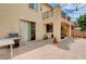 Inviting backyard with a patio, built-in grill, and access to a covered area, perfect for outdoor entertaining at 4308 Desert Haven Ave, North Las Vegas, NV 89085