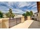 Balcony featuring iron railing and stucco pillars with scenic view of the landscape at 4308 Desert Haven Ave, North Las Vegas, NV 89085