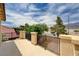 View from balcony featuring iron railing and stucco pillars with view of mountains at 4308 Desert Haven Ave, North Las Vegas, NV 89085