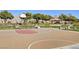 Outdoor basketball court with a gazebo, benches, and landscaping, set against a backdrop of mountains and trees at 4308 Desert Haven Ave, North Las Vegas, NV 89085