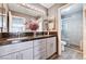 Luxurious bathroom featuring a glass shower, granite countertop, and modern vanity with double sinks at 4308 Desert Haven Ave, North Las Vegas, NV 89085