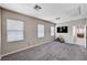 Bedroom with plush carpeting and natural light, complete with a TV and toys at 4308 Desert Haven Ave, North Las Vegas, NV 89085