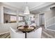 Bright dining area features wood-look flooring and a round table with seating for four at 4308 Desert Haven Ave, North Las Vegas, NV 89085