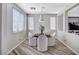 Bright dining area features wood-look flooring and a round table with seating for four at 4308 Desert Haven Ave, North Las Vegas, NV 89085
