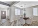 Bright dining area features wood-look flooring, a modern light fixture, and a round table with seating for four at 4308 Desert Haven Ave, North Las Vegas, NV 89085