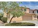 Charming two-story home featuring a two-car garage, inviting landscaping at 4308 Desert Haven Ave, North Las Vegas, NV 89085