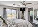 Bright and modern main bedroom features balcony access, scenic mountain views, and en suite bathroom at 4308 Desert Haven Ave, North Las Vegas, NV 89085