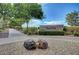Inviting park entrance with a stone sign, lush landscaping, a walking path, and mature trees at 4308 Desert Haven Ave, North Las Vegas, NV 89085