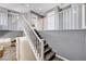 Wooden staircase with white railings, offering seamless transition between floors at 4308 Desert Haven Ave, North Las Vegas, NV 89085