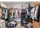 Spacious walk-in closet with ample storage space, including shelving and hanging rods at 4308 Desert Haven Ave, North Las Vegas, NV 89085