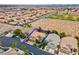 Aerial view of a home showcasing its well-manicured lawn, mature trees, and desert landscaping at 4326 Spooner Lake Cir, Las Vegas, NV 89147