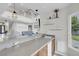 Entertainers bar with sink and view to both living room and backyard at 4326 Spooner Lake Cir, Las Vegas, NV 89147