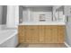 Spacious primary bathroom features a double vanity with white counters and shower with glass door at 4326 Spooner Lake Cir, Las Vegas, NV 89147