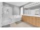 Contemporary bathroom with separate tub, shower, double sinks, and updated fixtures at 4326 Spooner Lake Cir, Las Vegas, NV 89147