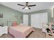 Bedroom with light-green paint, white trim, plush carpeting, and closet space at 4326 Spooner Lake Cir, Las Vegas, NV 89147